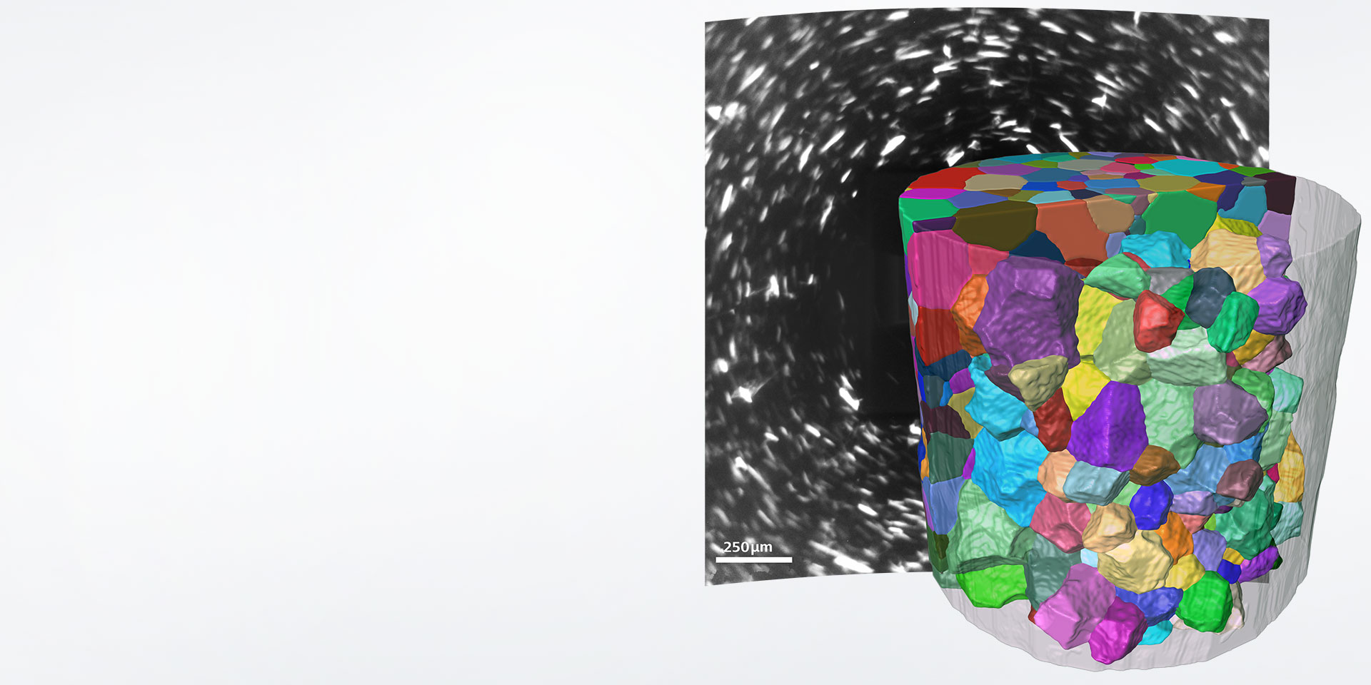  A reconstruction of the grain microstructure of Armco Iron, acquired with LabDCT. The grains are colored by crystallographic orientation, and the reconstruction reveals the true grain shape. The background shows an example of a diffraction pattern that is collected during the LabDCT acquisition.