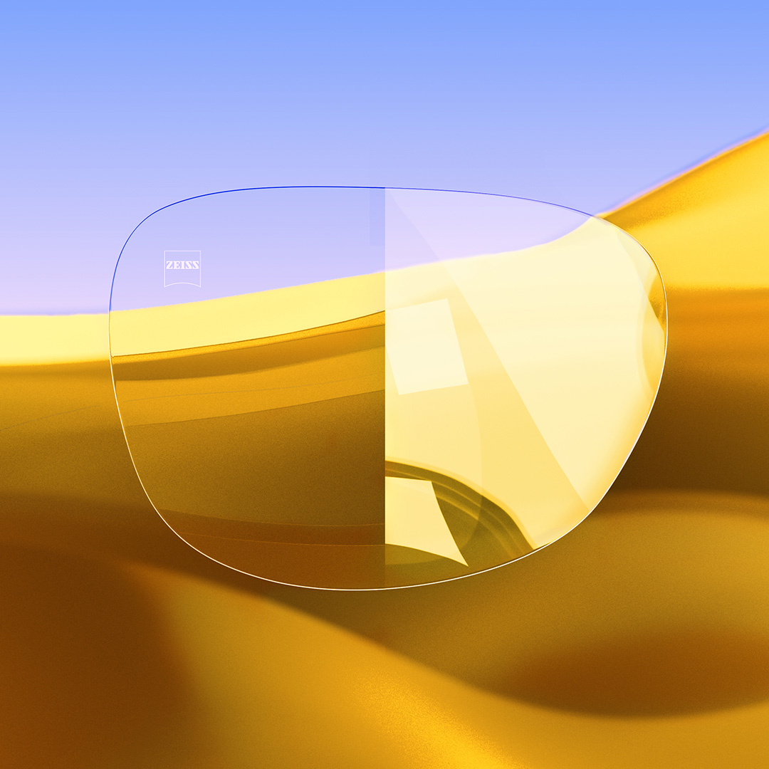 帶有蔡司 DuraVision Gold UV 的清晰、乾淨的鏡片和具有強烈反射的鏡片之分割圖像。 
